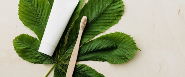 Bamboo toothbrush eco-friendly oral care on green leaf