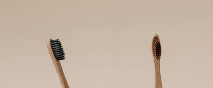 Eco-friendly bamboo toothbrushes in wooden toothbrush holders - sustainable oral care